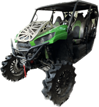 a green utv with large tires