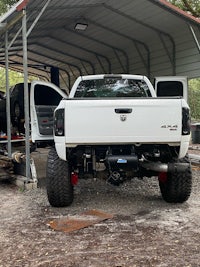 a white truck parked in a garage